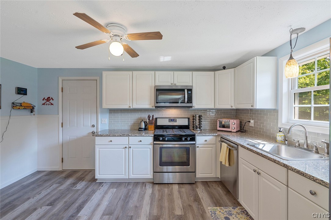47 Macarthur Road Lysander, NY 13027 - Photo 17 of 34 Remodeled kitchen boasts a lot of cabinetry