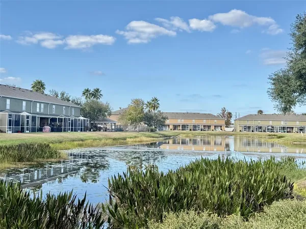 a view of a city with tall buildings and lake view