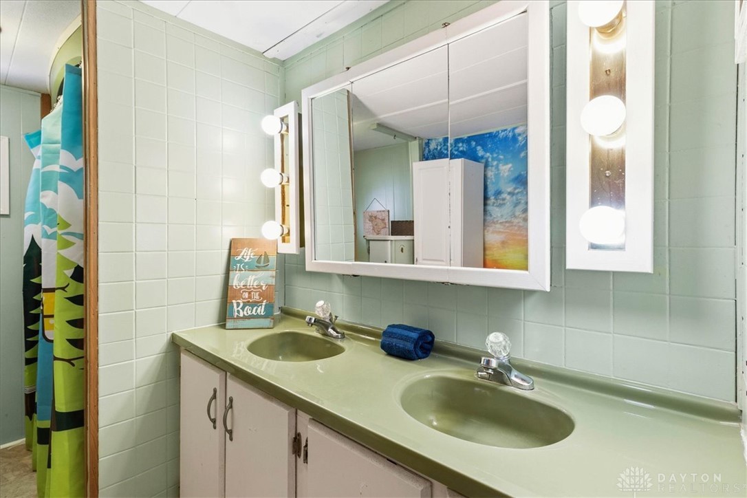 246 North Orchard Island Road Russells Point, OH 43348 - Photo 23 of 43 This bathroom features a double vanity and bright lighting for a refreshed start to your day.