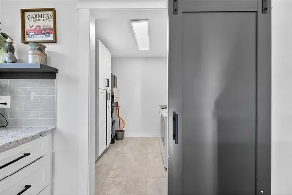 a view of livingroom with hallway and wooden floor