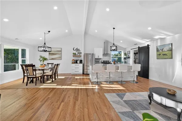 a bathroom with a sink toilet a mirror and shower