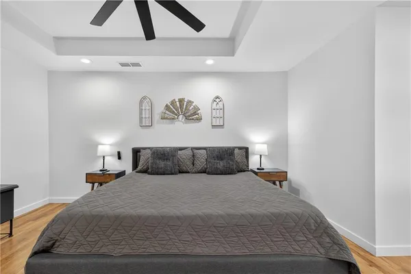 a view of a backyard with table and chairs and wooden fence