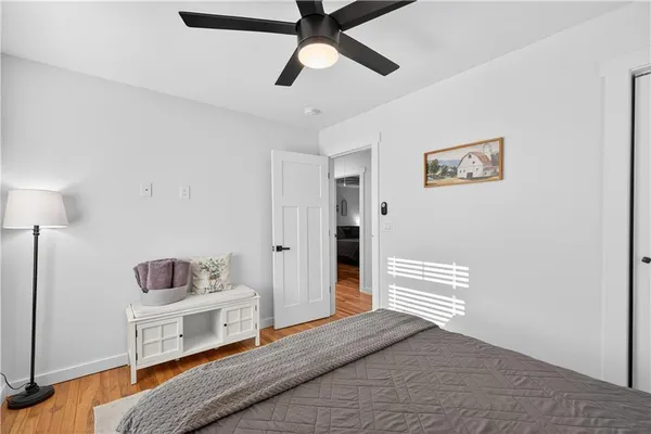 a view of backyard with swimming pool and seating space