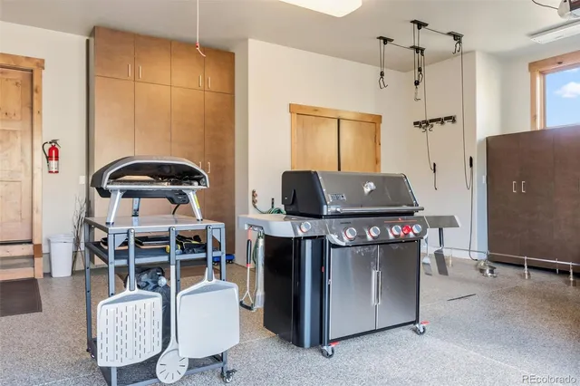 a living room with furniture a ceiling fan and a rug