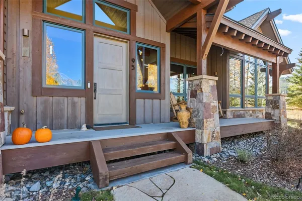 a backyard of a house with outdoor seating