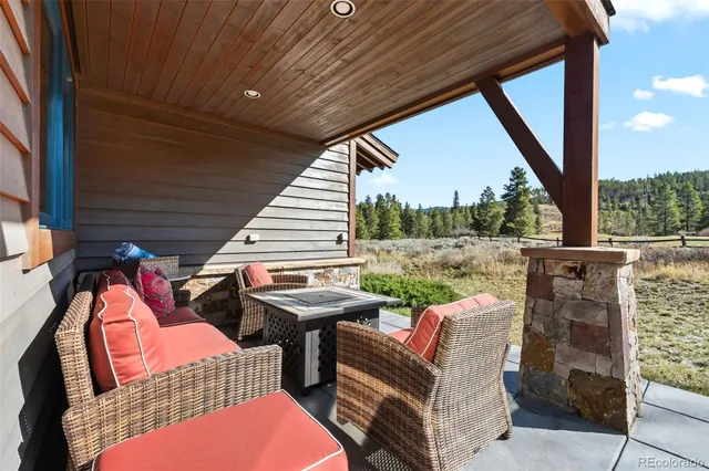a view of a patio with two chairs in the patio