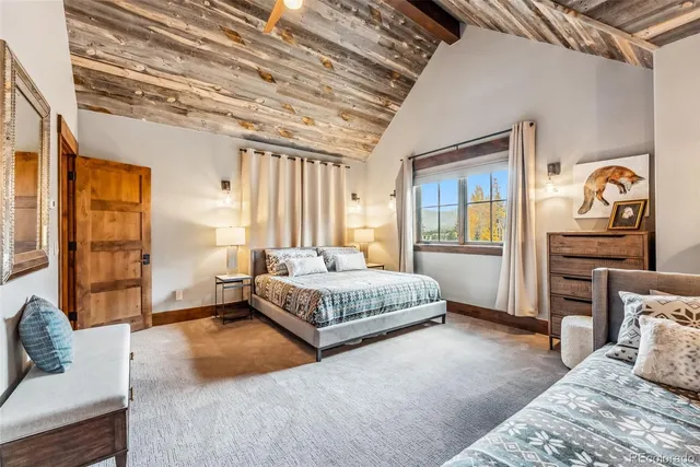 a spacious bedroom with a bed and window