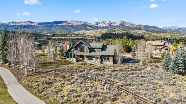 a view of a house with a mountain in the background