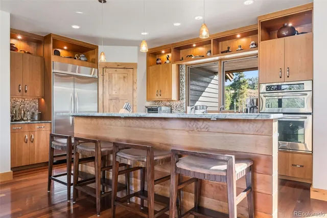 a kitchen with a table and chairs in it