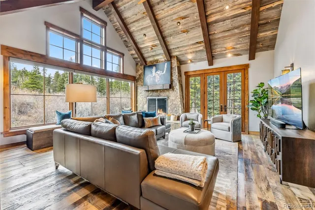 a living room with furniture fireplace and flat screen tv