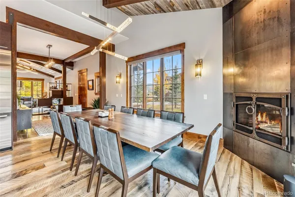 a view of a dining room with furniture window and wooden floor