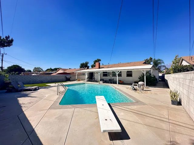 a view of a house with swimming pool