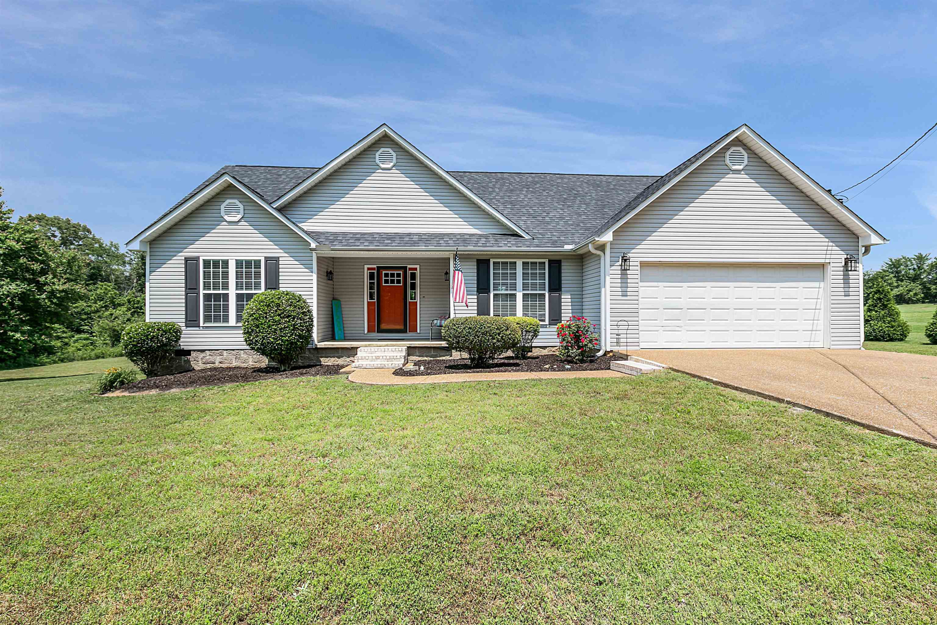 740 Corson Road Henderson, TN 38340 - Photo 1 of 15 a front view of a house with garden
