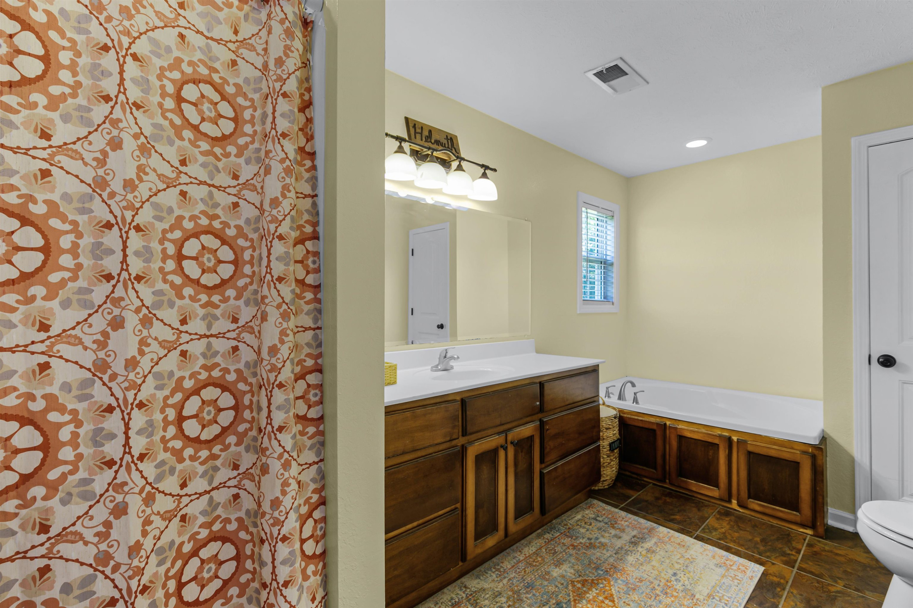 740 Corson Road Henderson, TN 38340 - Photo 12 of 15 a spacious bathroom with a double vanity sink and a mirror