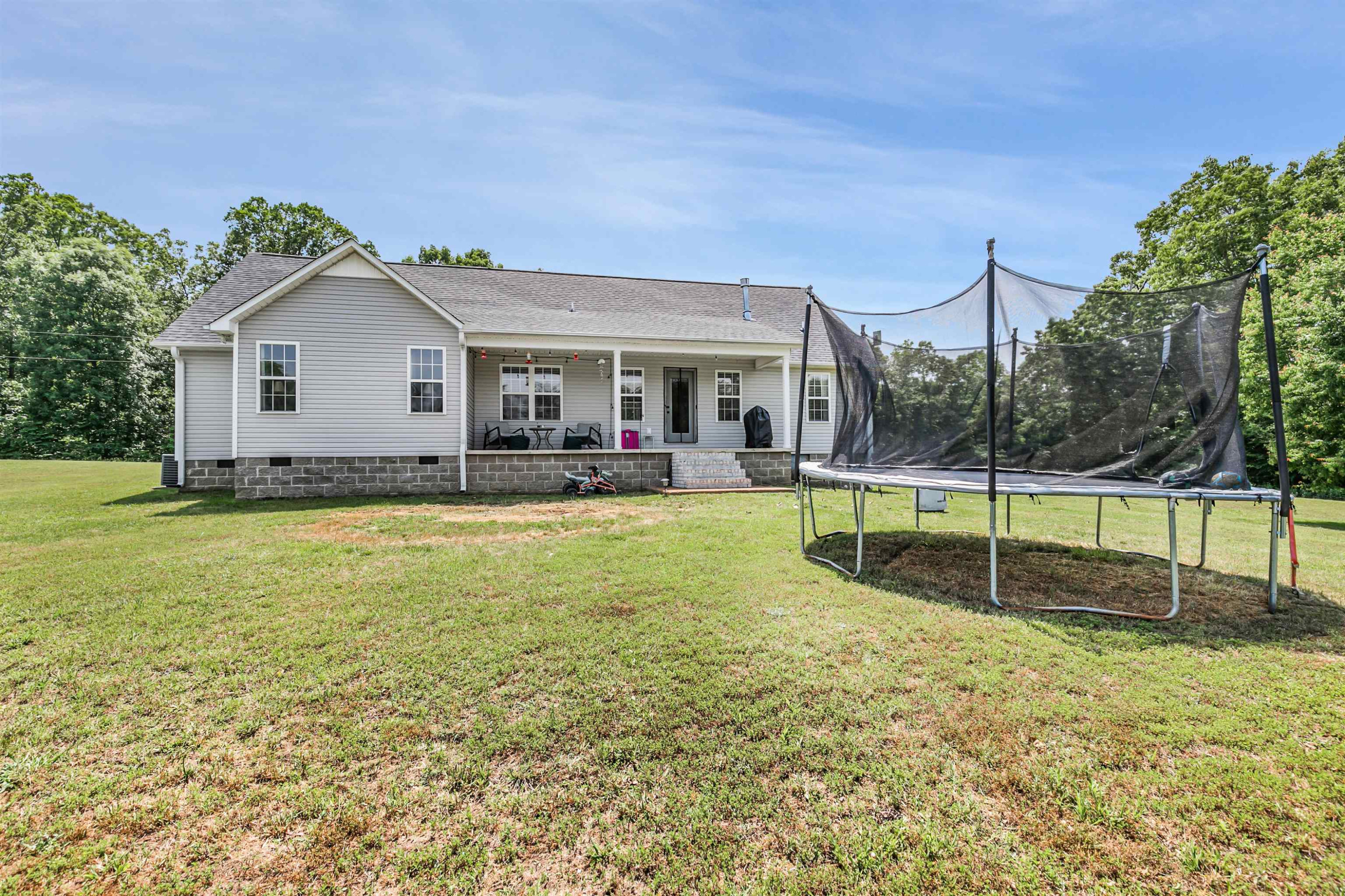 740 Corson Road Henderson, TN 38340 - Photo 2 of 15 a view of a house with backyard and porch