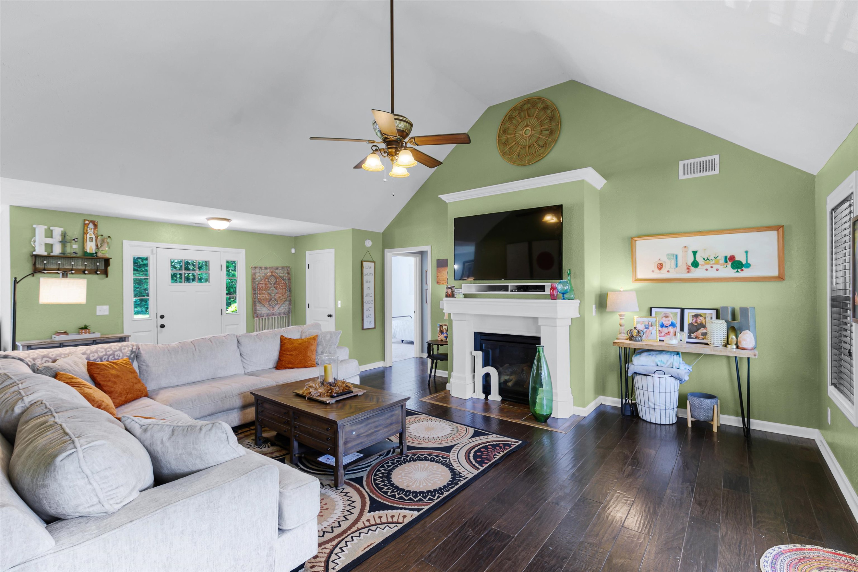 740 Corson Road Henderson, TN 38340 - Photo 5 of 15 a living room with furniture a fireplace and a flat screen tv