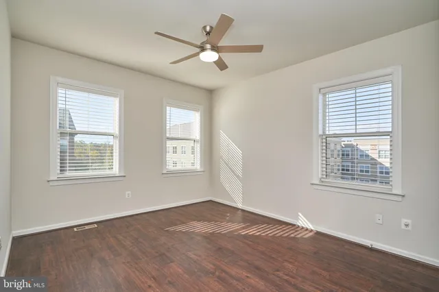 a bathroom with a double vanity sink toilet mirror and bathtub