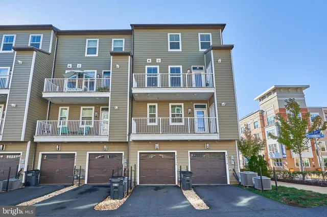 a front view of a building with lot of windows