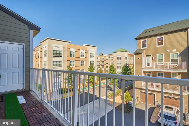 a big room with windows and fireplace