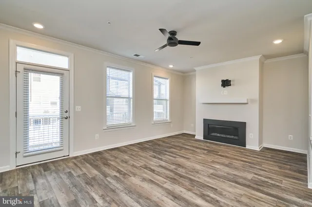 a living room with kitchen island furniture and a fireplace