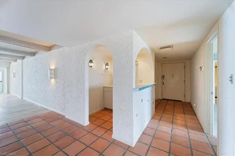 a kitchen with stainless steel appliances a stove a refrigerator and cabinets