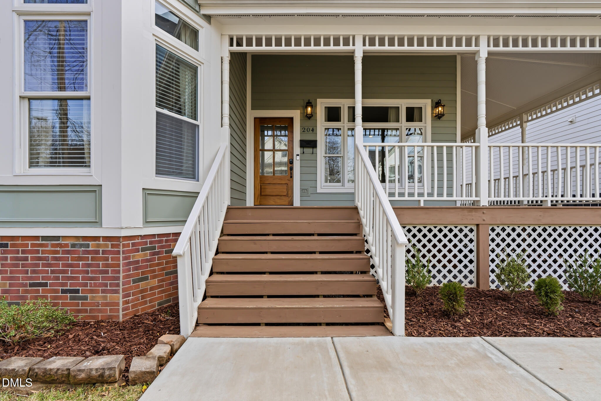 204 Georgetown Road Raleigh, NC 27608 - Photo 15 of 66 a view of a brick house with wooden fence
