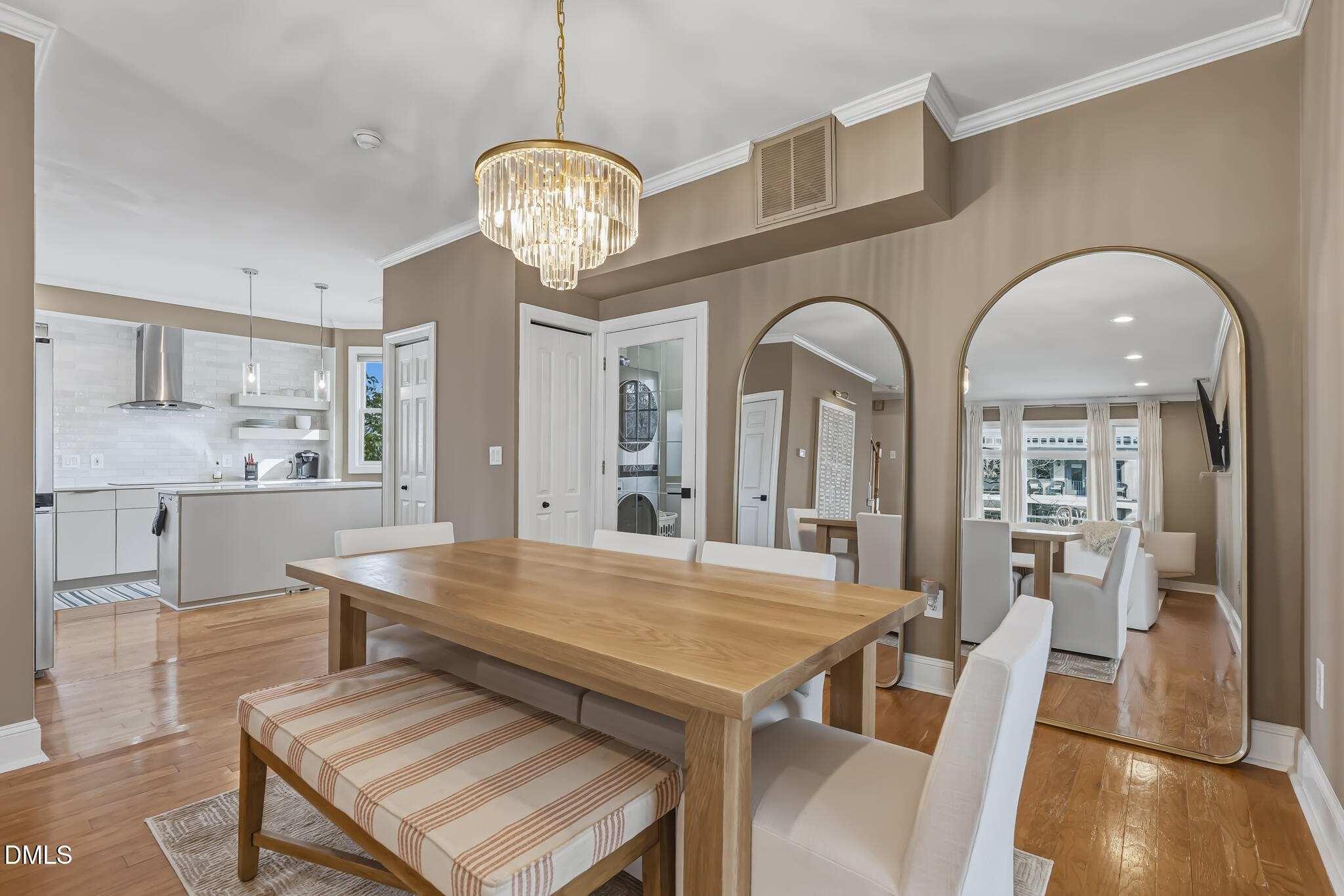 204 Georgetown Road Raleigh, NC 27608 - Photo 28 of 66 a view of a dining room with furniture a chandelier and wooden floor