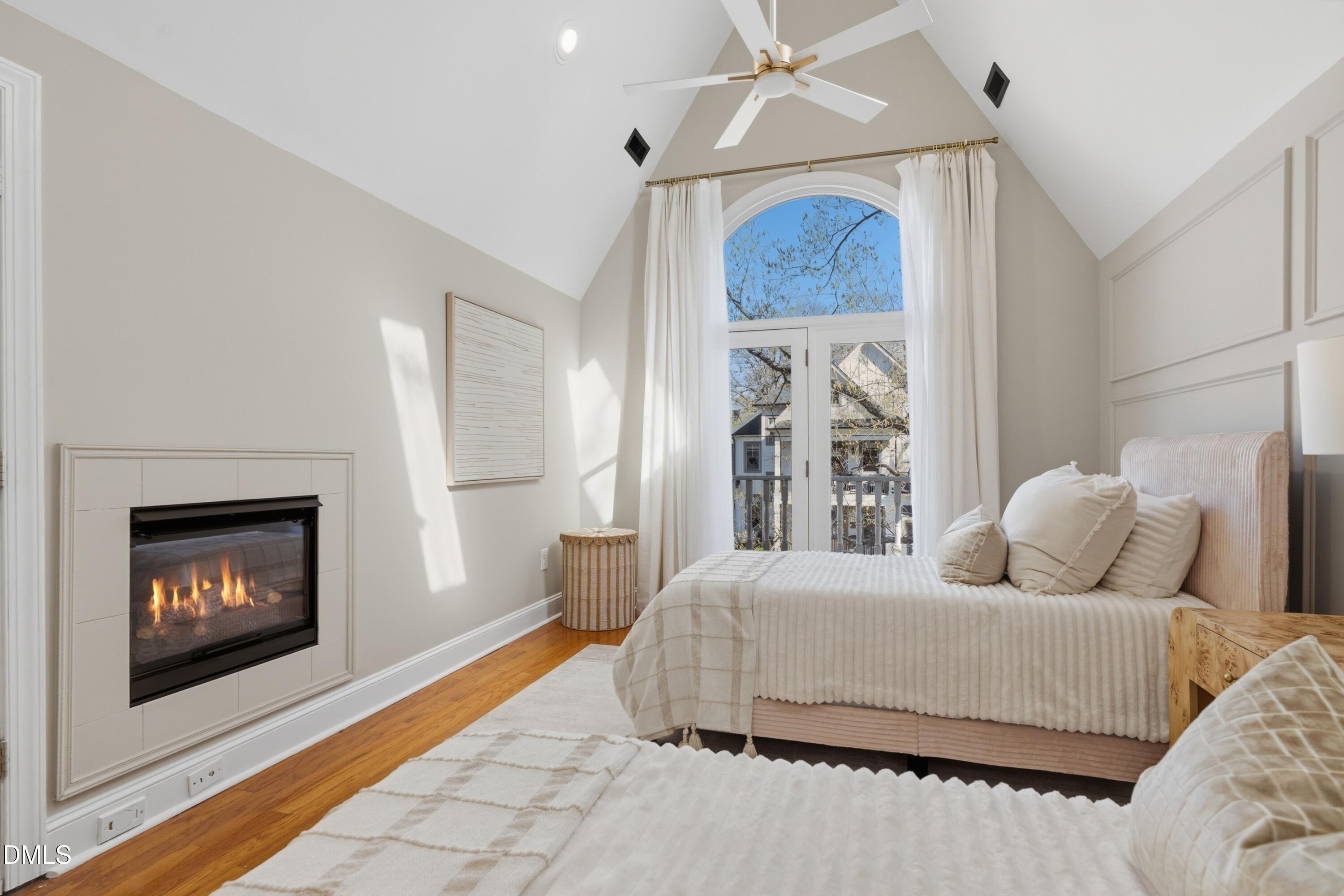 204 Georgetown Road Raleigh, NC 27608 - Photo 3 of 66 a bedroom with a bed and a fireplace