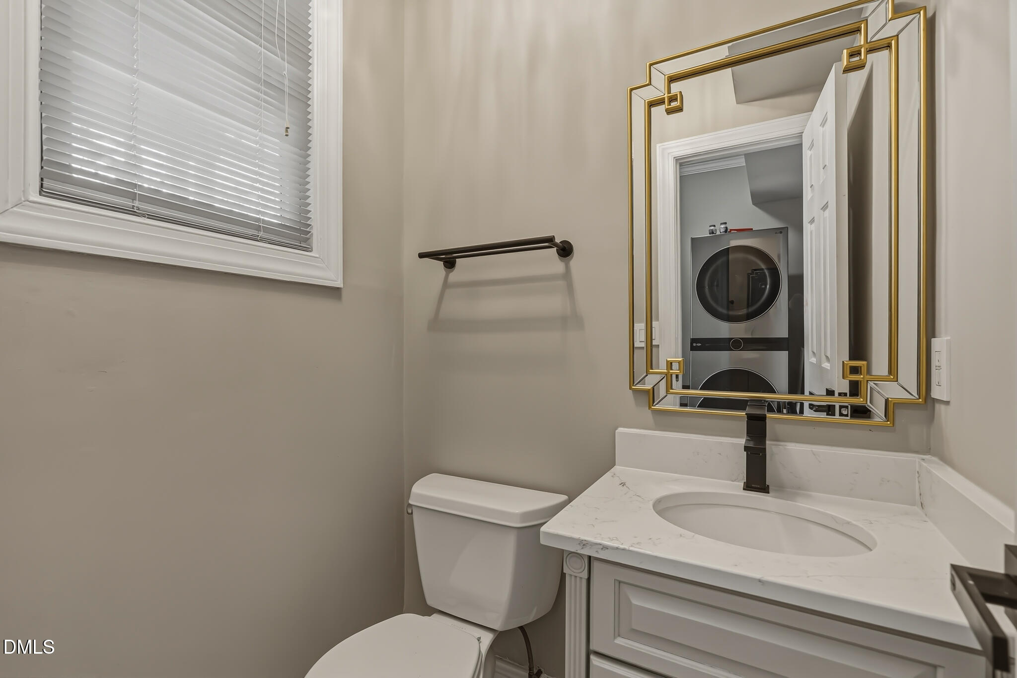 204 Georgetown Road Raleigh, NC 27608 - Photo 37 of 66 a bathroom with a sink a toilet and a mirror