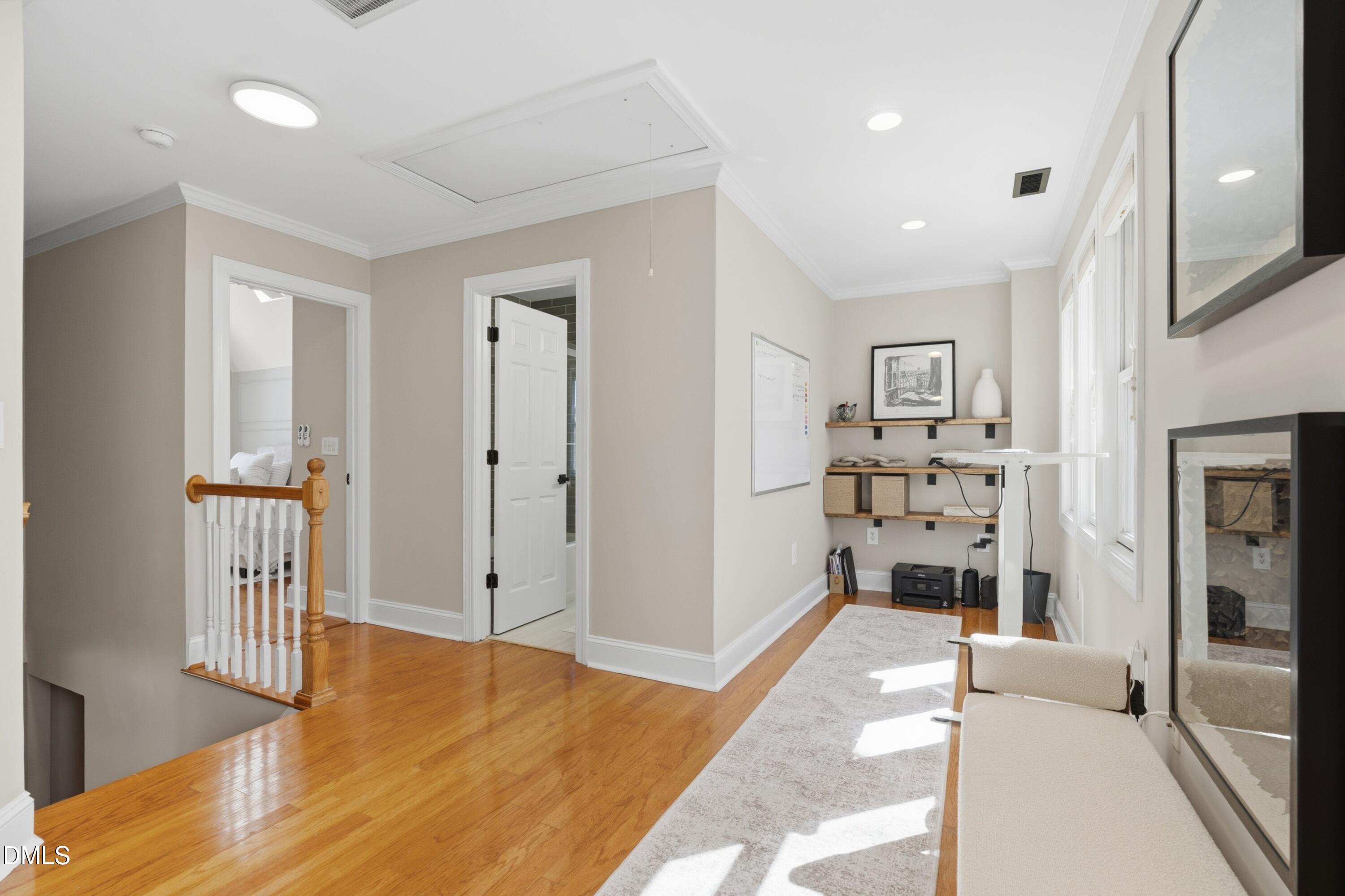 204 Georgetown Road Raleigh, NC 27608 - Photo 5 of 66 a spacious bedroom with a bed and walk in closet
