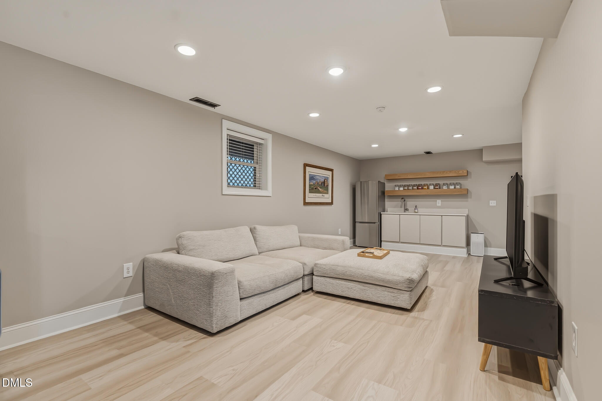 204 Georgetown Road Raleigh, NC 27608 - Photo 57 of 66 a living room with furniture and a flat screen tv