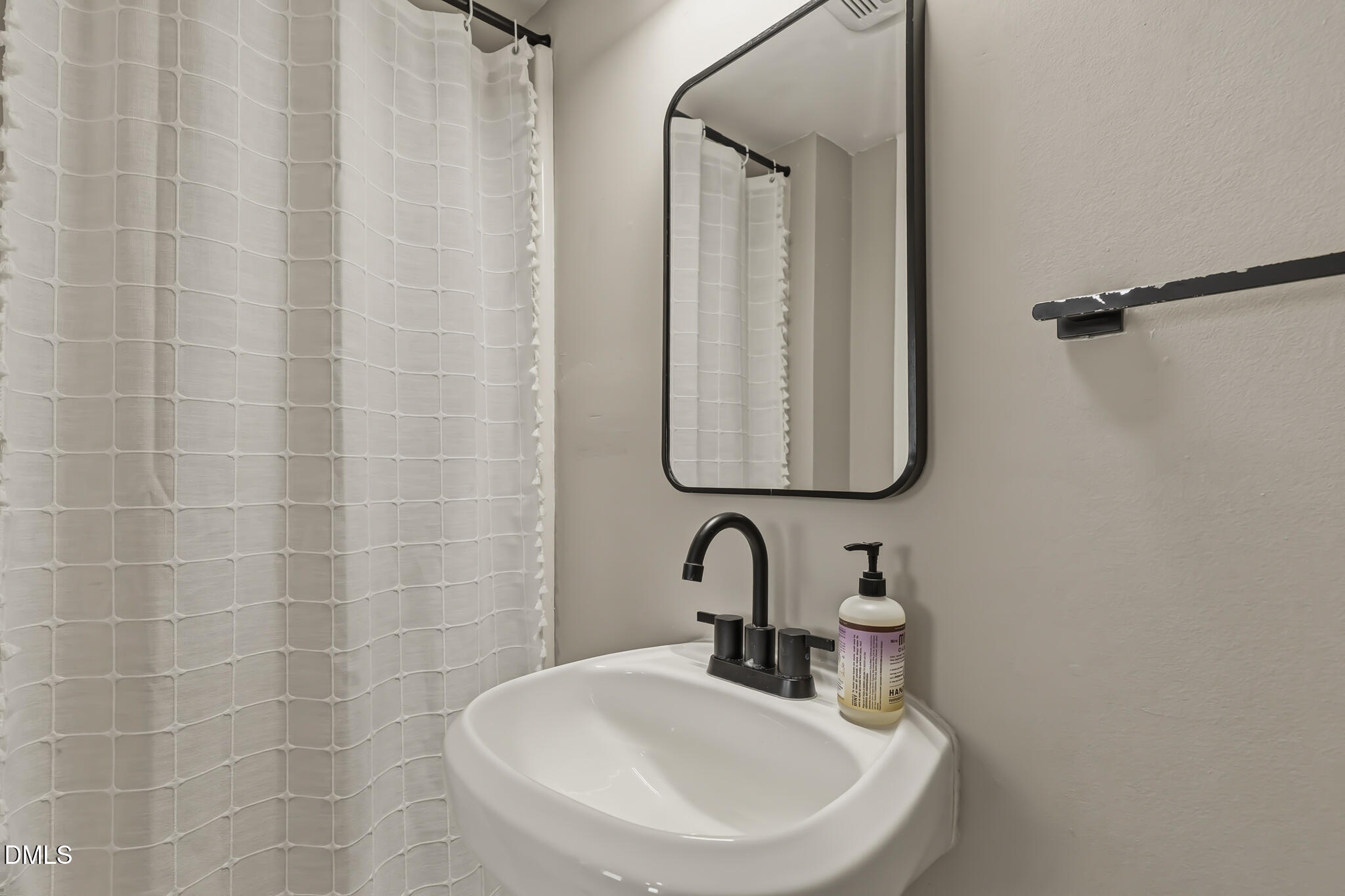 204 Georgetown Road Raleigh, NC 27608 - Photo 61 of 66 a bathroom with a sink and a mirror