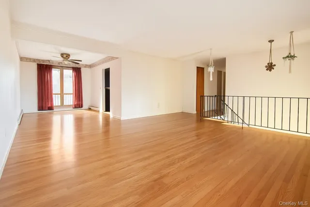 a view of an empty room with glass door