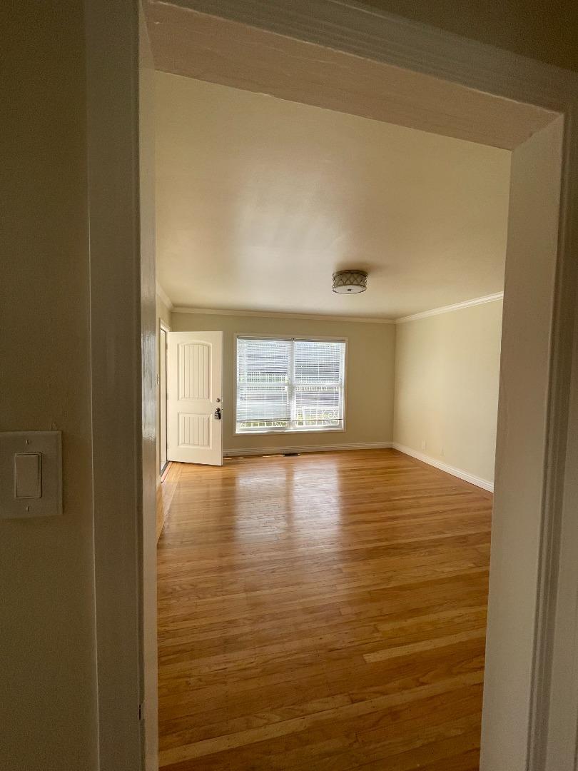 414 E Street Colma, CA 94014 - Photo 2 of 9 a view of empty room with wooden floor and fan