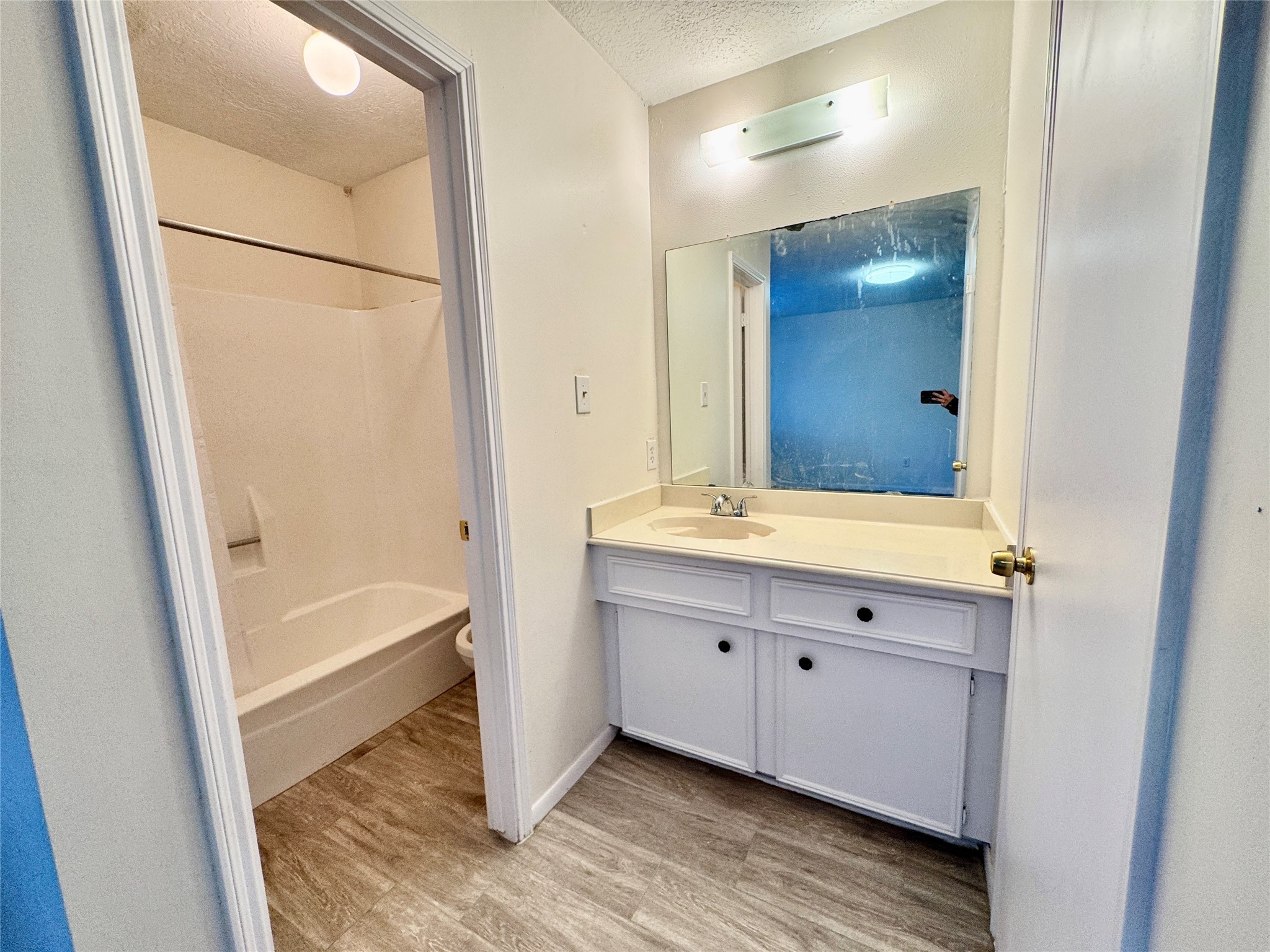 22306 Waynoka Road Katy, TX 77450 - Photo 15 of 21 a bathroom with a tub sink and mirror