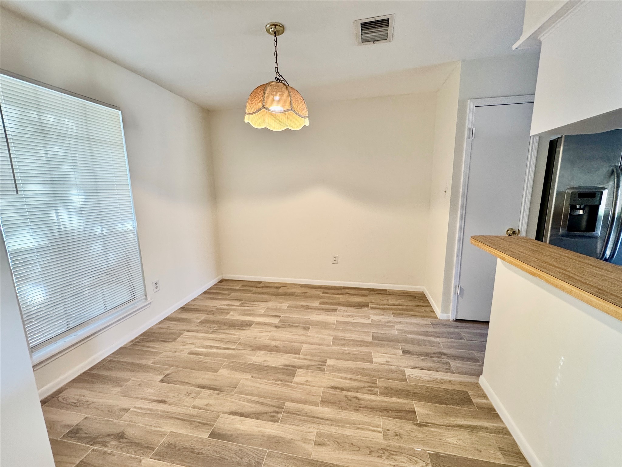 22306 Waynoka Road Katy, TX 77450 - Photo 4 of 21 a view of empty room with wooden floor