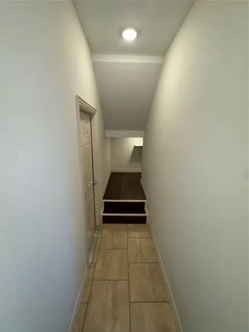 a bathroom with a granite countertop toilet and a sink