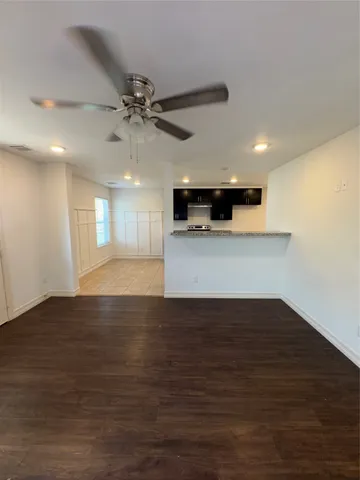 a view of a kitchen with a sink and a stove top oven