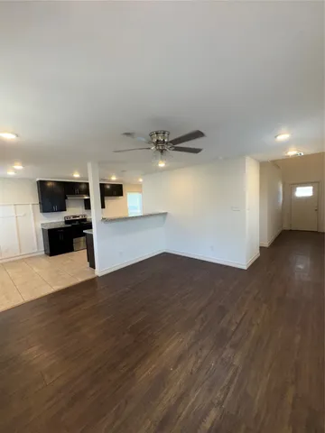 a large kitchen with stainless steel appliances granite countertop a large counter top and stove