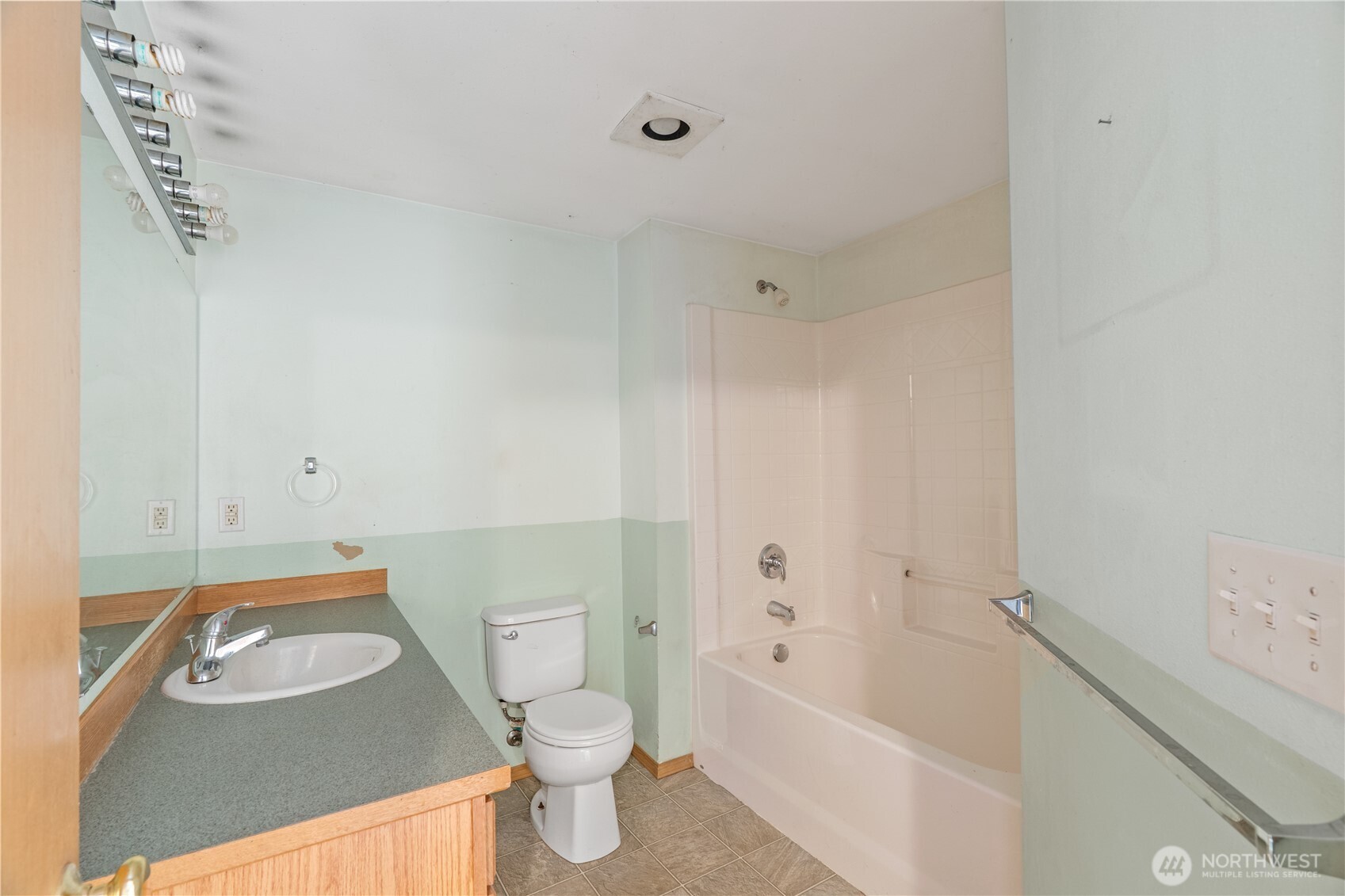 320 South 4th Street Elma, WA 98541 - Photo 12 of 35 a bathroom with a toilet sink vanity tub and shower