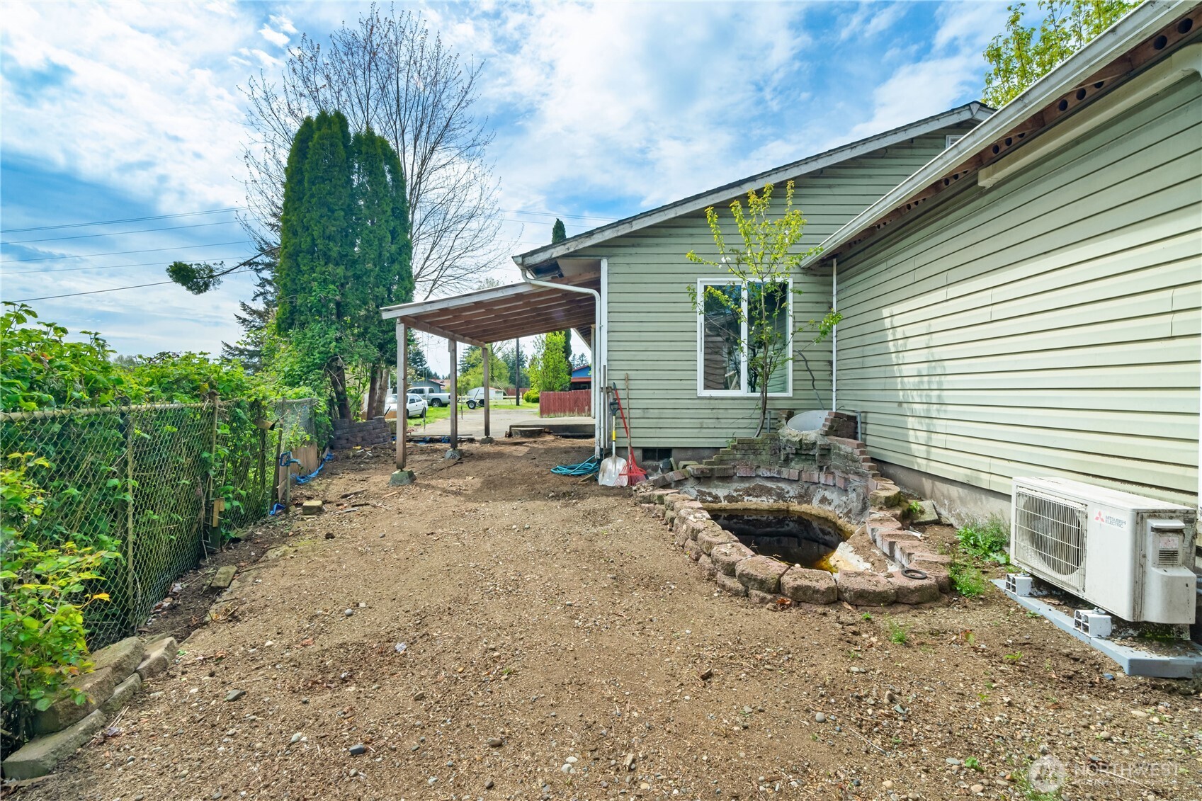 320 South 4th Street Elma, WA 98541 - Photo 24 of 35 a backyard of a house with yard and outdoor seating