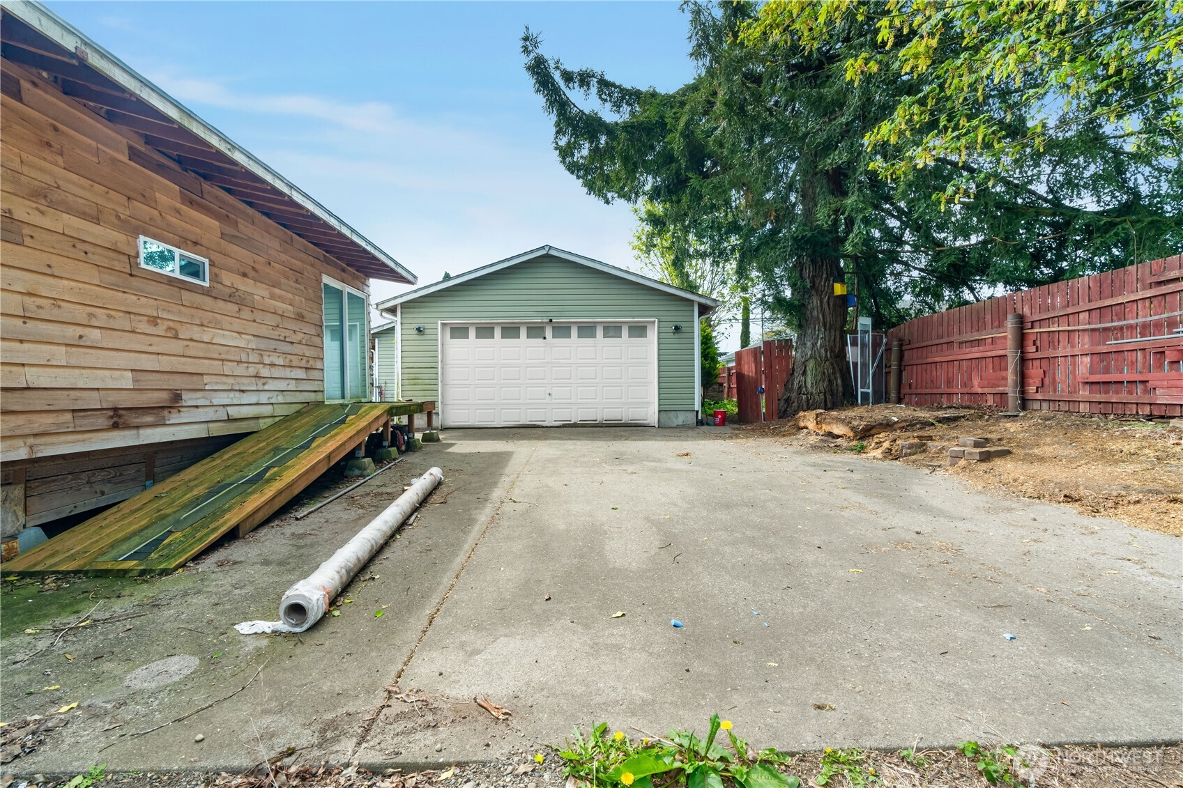 320 South 4th Street Elma, WA 98541 - Photo 27 of 35 a view of backyard with large trees and wooden fence