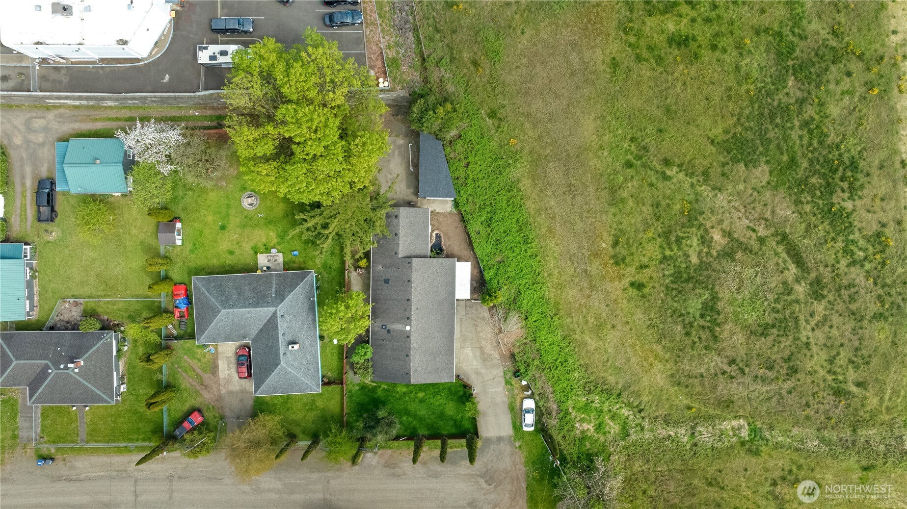 320 South 4th Street Elma, WA 98541 - Photo 30 of 35 an aerial view of a house with a yard
