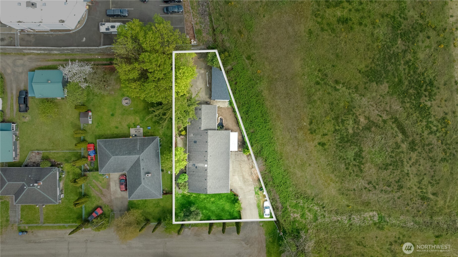320 South 4th Street Elma, WA 98541 - Photo 31 of 35 an aerial view of a house with a yard