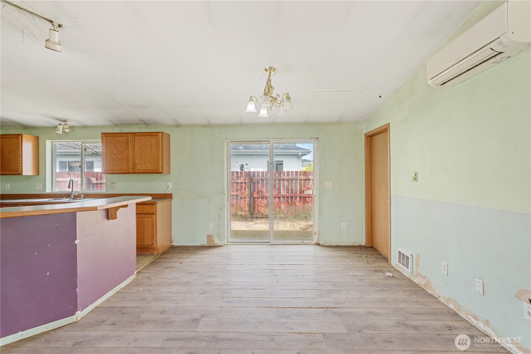 320 South 4th Street Elma, WA 98541 - Photo 6 of 35 a view of an empty room with window and wooden floor