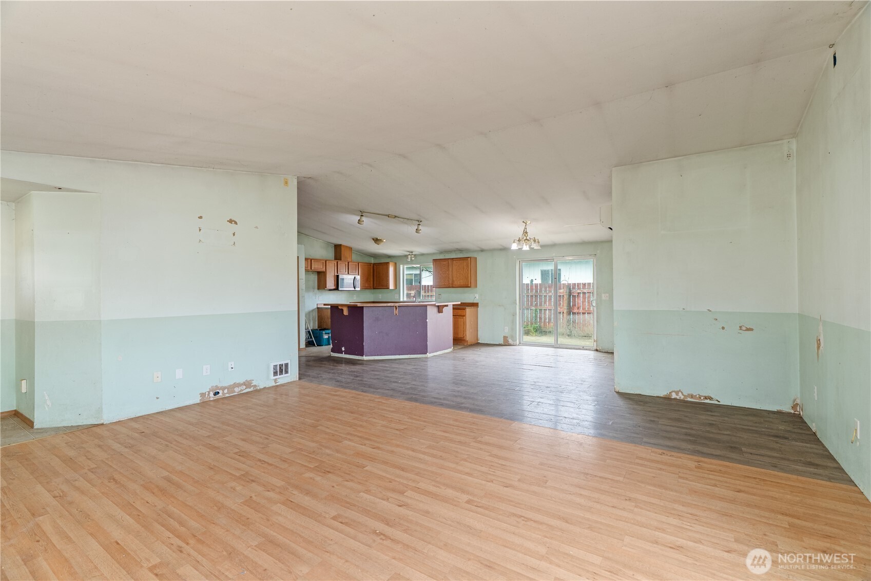 320 South 4th Street Elma, WA 98541 - Photo 7 of 35 a view of empty room with wooden floor and window
