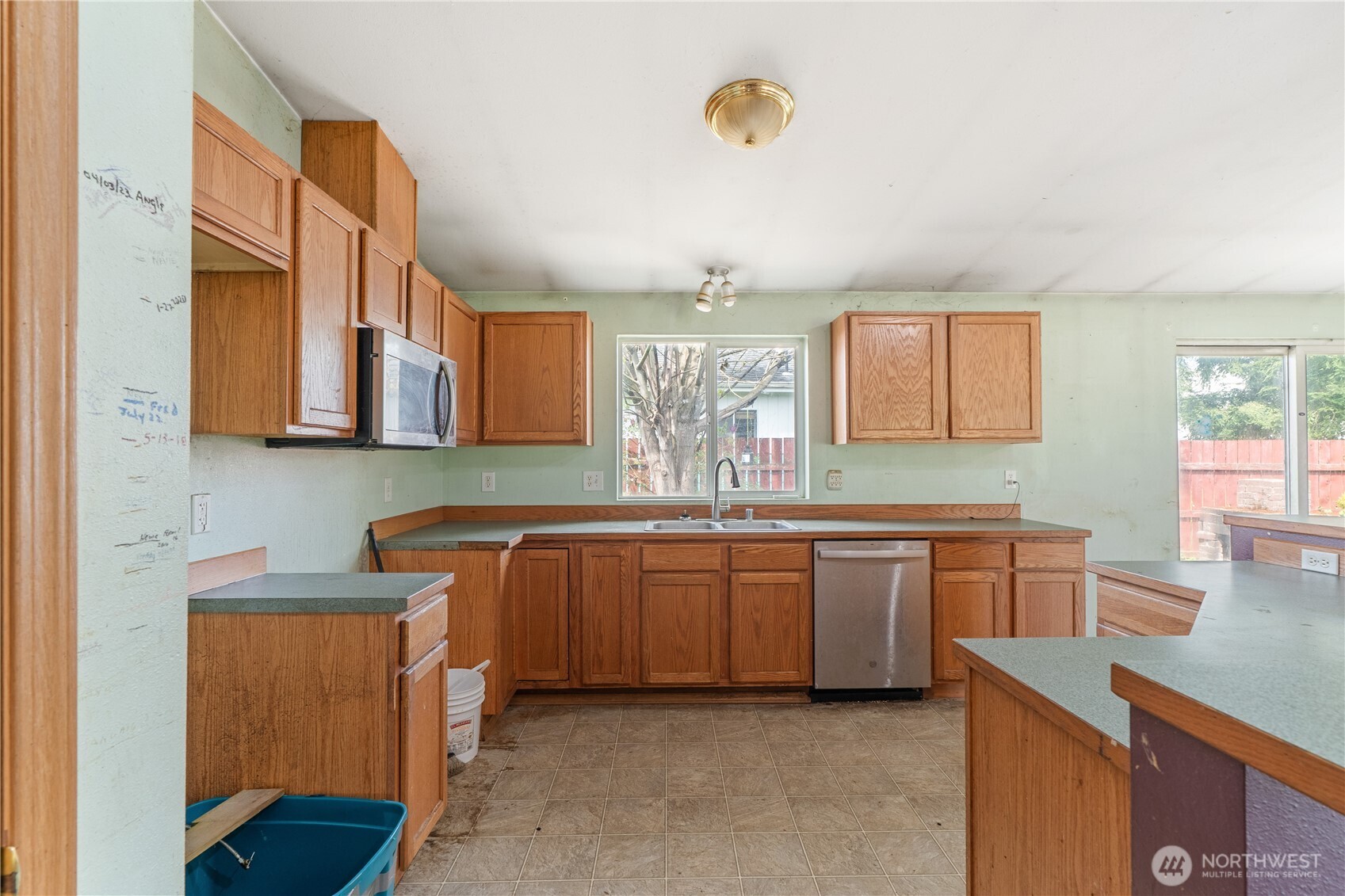 320 South 4th Street Elma, WA 98541 - Photo 9 of 35 a large kitchen with stainless steel appliances granite countertop a sink and dishwasher a stove with wooden cabinets