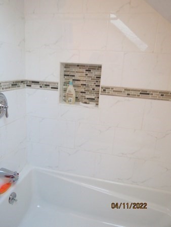 312 America Street Fall River, MA 02721 - Photo 13 of 26 a bathroom with a bathtub