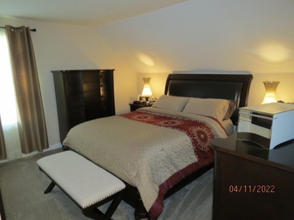 312 America Street Fall River, MA 02721 - Photo 14 of 26 a bedroom with a bed and a dresser