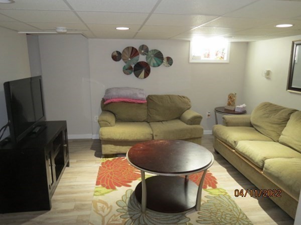 312 America Street Fall River, MA 02721 - Photo 17 of 26 a living room with furniture and a flat screen tv